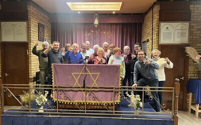 Council members of the two communities come together to celebrate the merger, February 2026