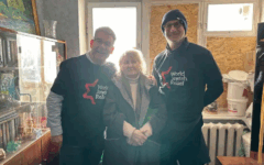 World Jewish Relief Chief Executive Paul Anticoni (left) and Chair Maurice Helfgott (right), with one of the Ukrainian Jews being helped by the charity in the wake of Russian attacks