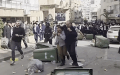 Police escort two female IDF soldiers to safety as ultra-Orthodox rioters chase them through the streets of Bnei Brak during unrest over conscription. Credit: Video via X / David Keshet