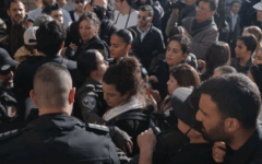 Tammy Gottlieb and Yochi Rappaport being detained by the police (Credit: Women of the Wall)