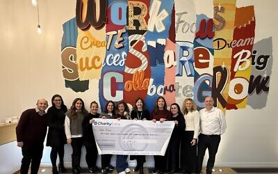 The-Work-Avenue-team-with-their-Charity-Extra-cheque. February 2026