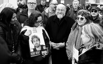 Chief Rabbi Sir Ephraim Mirvis and attendees of the Borehamwood Friday vigil (credit: Lisa Shaffer)