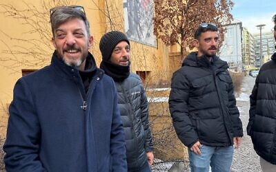 Brothers David, Eitan and Ariel Cunio, from left, stand outside the Berlin theater Babylon before a screening of a documentary about their family, Feb. 20, 2026. (Toby Axelrod)