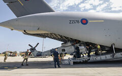 A Royal Navy Wildcat HMA Mk2 (HMA2) being unloaded from an RAF C-17, by RAF movers and RN personnel, at a British base in Cyprus. A Royal Navy Wildcat HMA Mk2 (HMA2) being unloaded from an RAF C-17, by RAF movers and RN personnel, at a British base in Cyprus.
