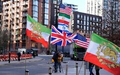Flags supporting Iranian independence outside the US Embassy in central London. Prime Minister Sir Keir Starmer has allowed the US to strike Iranian missile sites from British bases as officials plan an unprecedented rescue operation for UK citizens in the Gulf. Reports have also suggested the US could use RAF Fairford which can handle American heavy bombers. Picture date: Monday March 2, 2026.