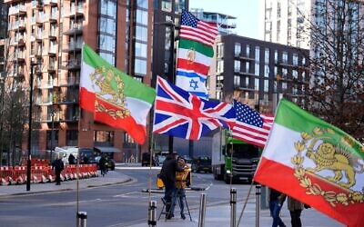 Flags supporting Iranian independence outside the US Embassy in central London. Prime Minister Sir Keir Starmer has allowed the US to strike Iranian missile sites from British bases as officials plan an unprecedented rescue operation for UK citizens in the Gulf. Reports have also suggested the US could use RAF Fairford which can handle American heavy bombers. Picture date: Monday March 2, 2026.