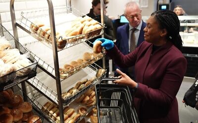 Conservative Party leader Kemi Badenoch places bagels into a basket during a visit to Grodz bakery, in Golders Green, north London. Picture date: Monday March 16, 2026.