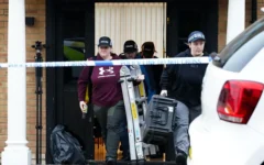 Police search team members leave a property on Brookdene Avenue on 13 March  (Photo Credit: Jamie Lashmar/PA)