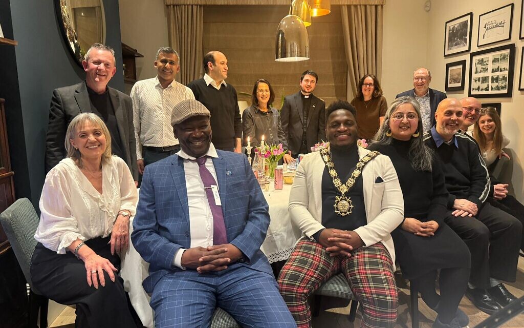 Guests from Jewish, Christian and Muslim communities gather for a multi-faith seder hosted by Laura Marks CBE in north London