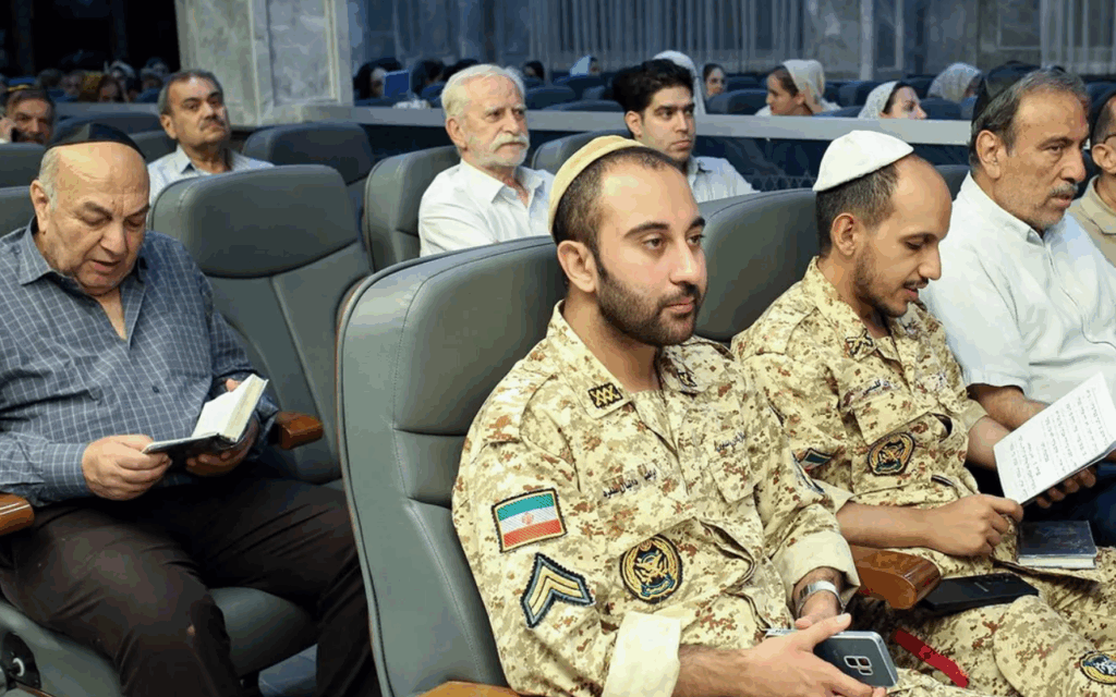 Iranian Jews - including Jewish members of the country's armed forces, attend an event in support of the regime at a shul in Tehran, in pictures subsequently released by state media