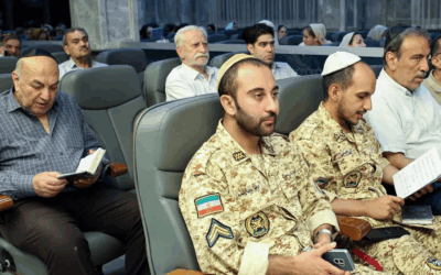 Iranian Jews - including Jewish members of the country's armed forces, attend an event in support of the regime at a shul in Tehran, in pictures subsequently released by state media