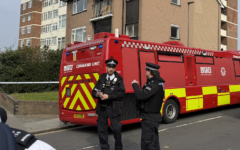 Police officers stand near a London Fire Brigade command unit at the scene in Golders Green following the arson attack on Hatzola ambulances. Photo: Annabel Sinclair