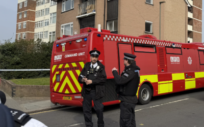 Police officers stand near a London Fire Brigade command unit at the scene in Golders Green following the arson attack on Hatzola ambulances. Photo: Annabel Sinclair