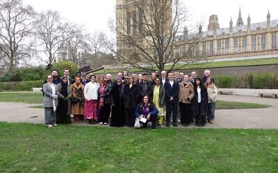Faith leaders and volunteers from Jewish, Muslim and Christian organisations gather outside the House of Lords following the “Faith in Charity” reception. Credit: Ali Milani