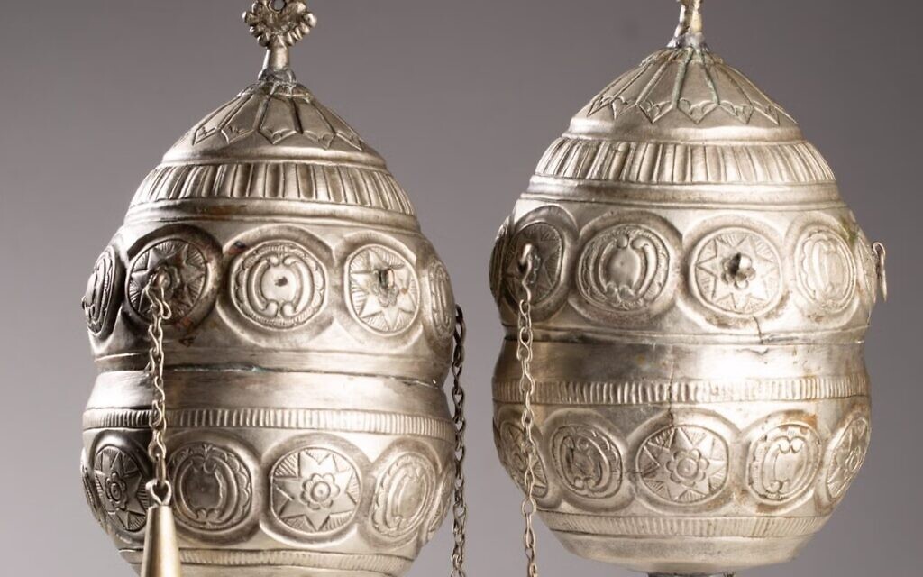 A pair of finials, which adorned the wooden rollers of a Torah scroll, are among the artifacts being returned to Greece. (Jewish Historical Institute in Warsaw)