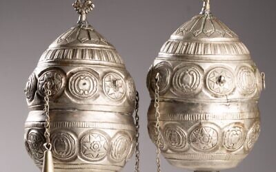 A pair of finials, which adorned the wooden rollers of a Torah scroll, are among the artifacts being returned to Greece. (Jewish Historical Institute in Warsaw)