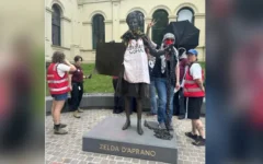 Protesters gathered around the statue of Zelda D’Aprano in Melbourne after it was allegedly defaced with red paint earlier this month. Credit: X