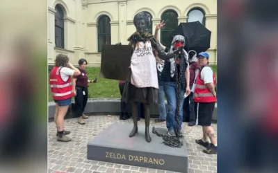 Protesters gathered around the statue of Zelda D’Aprano in Melbourne after it was allegedly defaced with red paint earlier this month. Credit: X