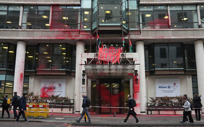Members of Palestine Action occupy and deface the entrance of a branch of Allianz Insurance commercial offices in Gracechurch Street, London