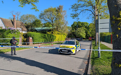 Police officers patrol at a cordon near to an incident at the Kenton United Synagogue in Harrow, north-west London, where an attempted arson attack overnight has caused minor smoke damage to an internal room but no injuries or significant structural damage, the Community Security Trust said. Picture date: Sunday April 19, 2026. PA Photo. Photo credit should read: Jamie Lashmar/PA Wire