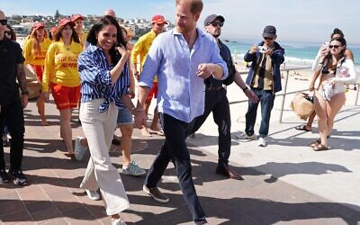 Prince Harry, and Meghan, the Duke and Duchess of Sussex, walk along the boardwalk after meeting volunteer first responders from Bondi Surf Bathers' Life Saving Club, during a visit to Bondi Beach, Australia, Friday, April 17, 2026. (Jonathan Brady/Pool Photo via AP)