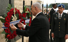 Israeli Prime Minister Benjamin Netanyahu places a wreath during a ceremony marking Israel's Memorial Day for fallen soldiers at the military cemetery on Mount Herzl in Jerusalem, April 21, 2026. (Ilia Yefimovich / Pool / AFP via Getty Images via JTA) Israeli Prime Minister Benjamin Netanyahu places a wreath during a ceremony marking Israel's Memorial Day for fallen soldiers at the military cemetery on Mount Herzl in Jerusalem, April 21, 2026. (Ilia Yefimovich / Pool / AFP via Getty Images via JTA)