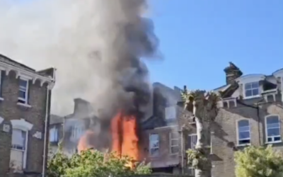Flames rise from a building beside a synagogue on Cazenove Road in Stamford Hill as emergency crews respond to the blaze on Thursday afternoon. Photo credit: The Yeshiva World News / X screenshot