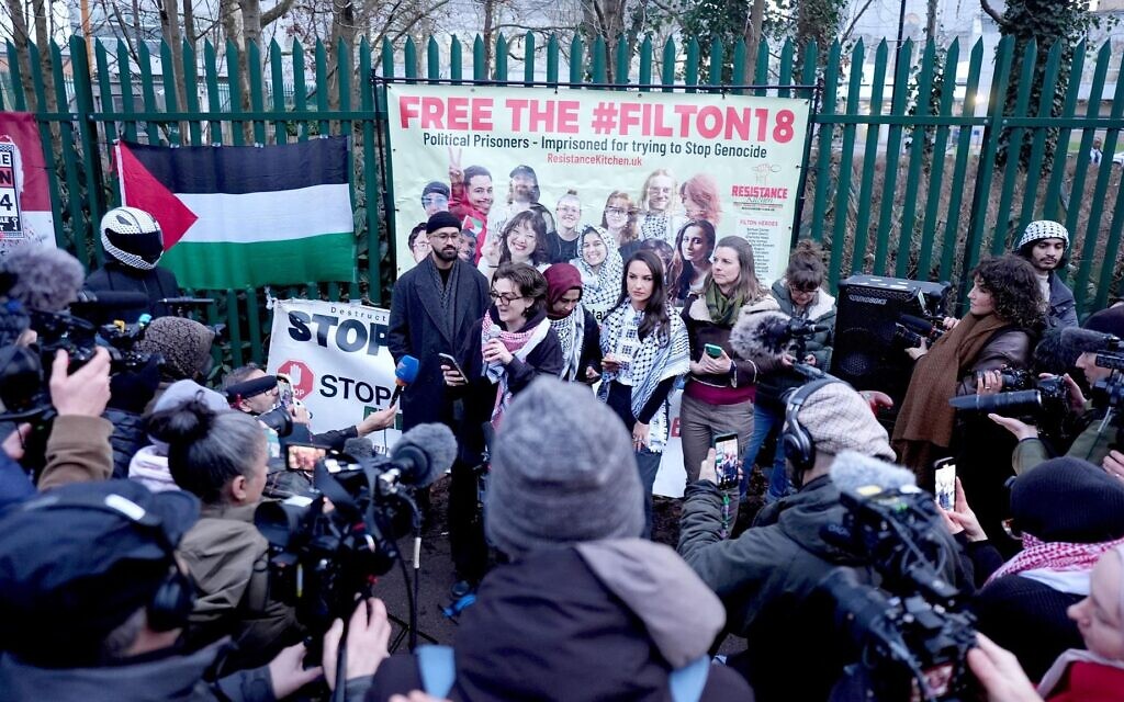 Palestine Action supporters hold “Free the Filton 18” banner outside court as trial hears activists threatened site destruction. Photo: PA