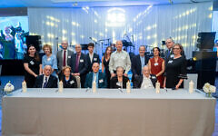 Lighting memorial candles at 45 Aid Reunion dinner May 2026 — five survivors from left Arek Hersh, Mala Tribich, Jackie Young, Rachel Levy, Jan Goldberger, and two Second Gen Mark Frydenberg and Judi Roth
Gary Perlmutter Photography Lighting memorial candles at 45 Aid Reunion dinner May 2026 — five survivors from left Arek Hersh, Mala Tribich, Jackie Young, Rachel Levy, Jan Goldberger, and two Second Gen Mark Frydenberg and Judi Roth
Gary Perlmutter Photography