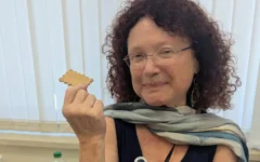 Professor Mona Kidon holds one of the “Mona Cookies” developed as part of the peanut allergy treatment trial. Photo Credit: Sheba Medical Centre. Professor Mona Kidon holds one of the “Mona Cookies” developed as part of the peanut allergy treatment trial. Photo Credit: Sheba Medical Centre.