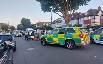 Emergency services, including Hatzola, Shomrim and Metropolitan Police officers, at the scene of the collision on Golders Green Road on Wednesday night. Credit: Shomrim/X