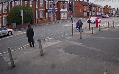 A white mercedes approached the pedestrian crossing, and subsequently ran the light, almost knocking down a Jewish family (Credit: Connect UK)