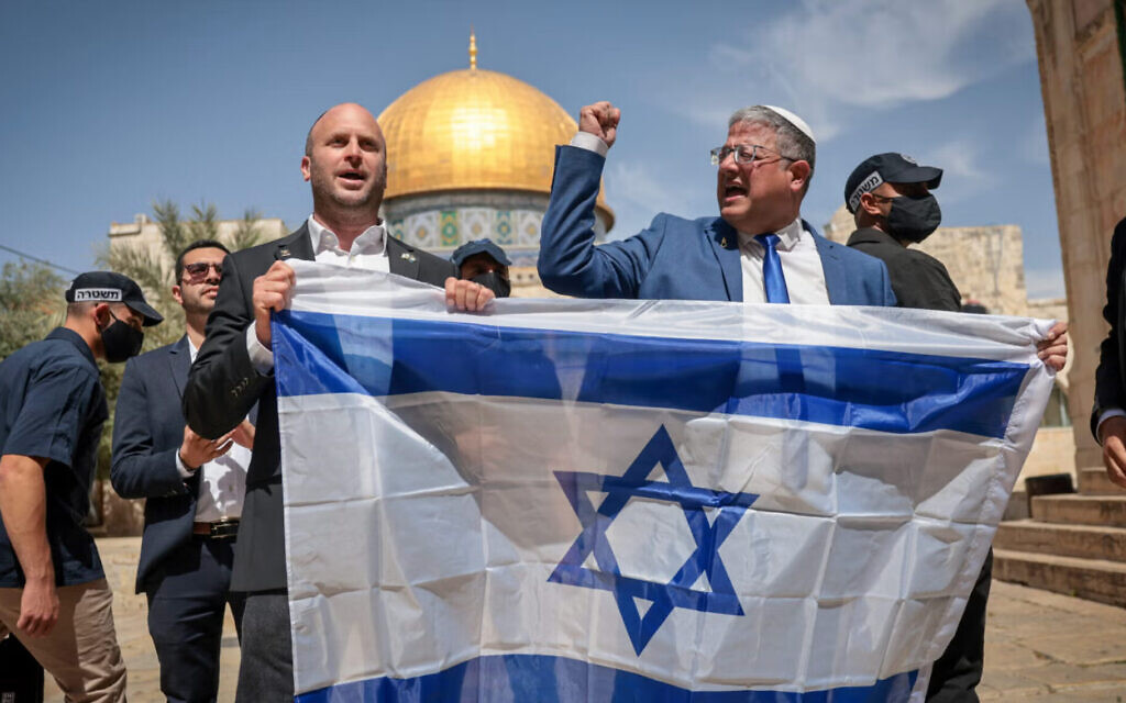 Minister of National Security Itamar Ben Gvir waves the Israeli flag as he tours the Temple Mount in Jerusalem's Old City. May 14, 2026. Photo by Yonatan Sindel/FLASH90
