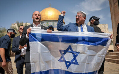 Minister of National Security Itamar Ben Gvir waves the Israeli flag as he tours the Temple Mount in Jerusalem's Old City. May 14, 2026. Photo by Yonatan Sindel/FLASH90