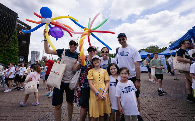 Families enjoy the festival atmosphere in the Fun Zone at the Maccabi GB Community Fun Run.