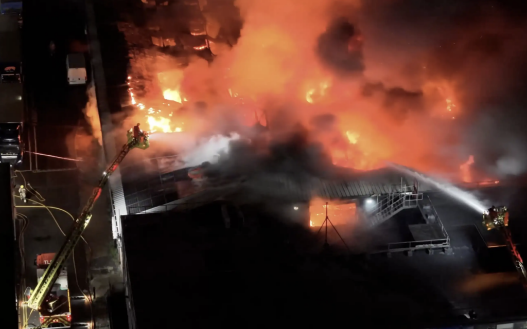 Firefighters tackle the blaze at SVS Productions' warehouse in Brent after a major fire destroyed the building and its contents. Credit: @yedisdroneshots