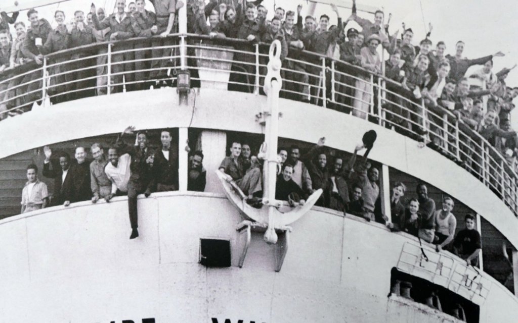 The Empire Windrush carrying Caribbean passengers to Britain in 1948, a journey that became a defining moment in modern British history.