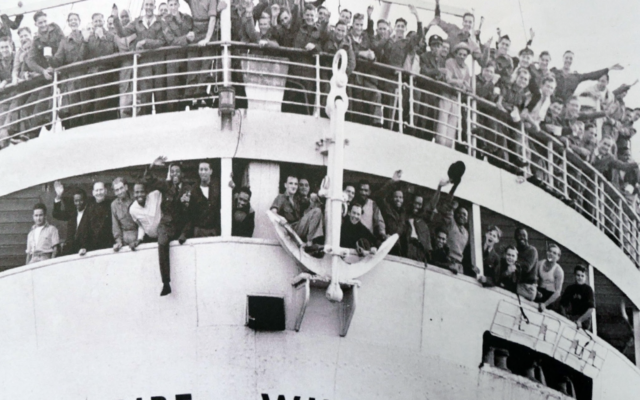 The Empire Windrush carrying Caribbean passengers to Britain in 1948, a journey that became a defining moment in modern British history.