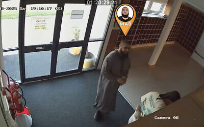 Handout grab dated 09/08/25 taken from CCTV issued by Greater Manchester Police (GMP) of Mohammad Bashir and Jihad Al-Shamie at the Al Sunnah Mosque in Manchester, where they mistakenly believed they had hidden from the cameras and that their conversations would not be overheard. Mohammad Bashir, 31, who planned a terror attack with his friend - who went on a fatal knife rampage at a Manchester synagogue less than two months later - has been sentenced to life with a minimum term of 17 years at Manchester Crown Court.