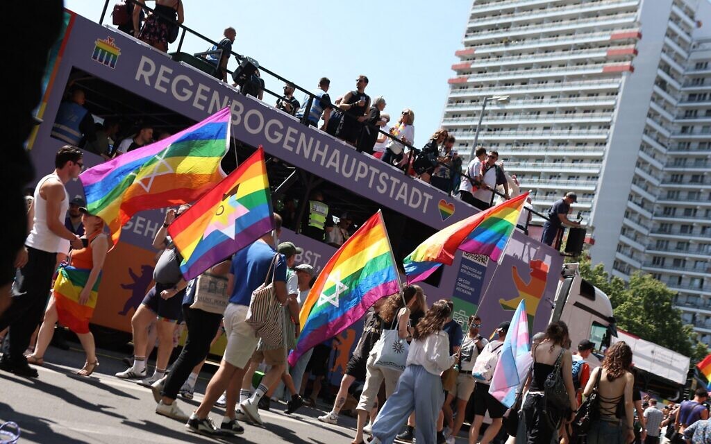 Participants march with rainbow and Jewish Pride flags during Berlin's Christopher Street Day (CSD) celebrations, hours before the deadly attack. Photo Credit: Felix Wolf/Alamy Live News
