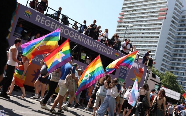 Participants march with rainbow and Jewish Pride flags during Berlin's Christopher Street Day (CSD) celebrations, hours before the deadly attack. Photo Credit: Felix Wolf/Alamy Live News