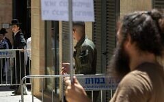 Haredi protesters and secular counter-protesters are separated by police outside Cafe Basimta in Jerusalem, July 18, 2026. (Theia Chatelle) Haredi protesters and secular counter-protesters are separated by police outside Cafe Basimta in Jerusalem, July 18, 2026. (Theia Chatelle)