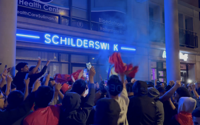 Crowds gather outside the Schilderswijk Health Centre in The Hague after Morocco's World Cup defeat to France, where antisemitic chants were heard. Photo: X