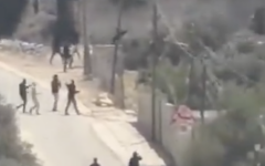 Palestinians and armed Israeli civilians during the confrontation near Tel in Samaria. Photo: X