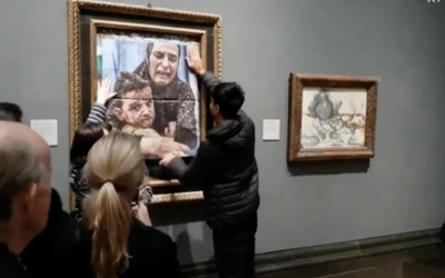 Youth Demand activists cover Pablo Picasso's Motherhood with an image of a mother and child from Gaza during their protest at the National Gallery.

Photo Credit: X / Youth Demand