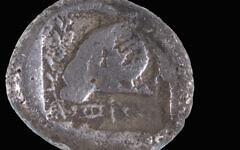 The rare 2,500-year-old Persian-period coin discovered on Ashdod beach, believed to be the first of its type found in Israel. Photo Credit: Shay Halevi/Israel Antiquities Authority