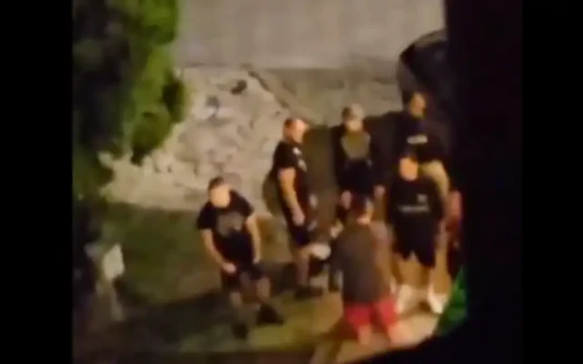 A group of men gathered outside a hotel housing Jewish teenagers in Bansko, Bulgaria. Credit: X