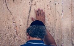 Jewish man praying with emotion at the the Western Wall. Jewish man praying with emotion at the the Western Wall.