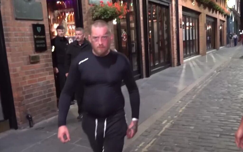The man approaches the i24NEWS crew during the confrontation in Belfast. (Photo Credit: i24NEWS/X)