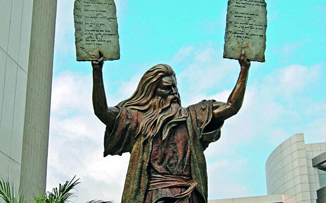A statue of Moses returning from the summit of Mount Sinai with ten broadly decent ideas, ready to be passed down the generations